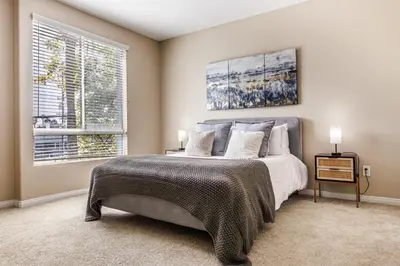 a bedroom with a bed and a large window at Spacious 3-Bedroom 3BTH Apt in Marina Del Rey! Pool, Hot Tub in Los Angeles