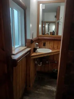 a bathroom with a sink and a mirror at Big Bear Lake - Tulip Lane Cabin #24 in Big Bear Lake