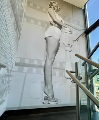 a mural of a woman on a wall in a building at Hotel Rudra - Hollywood in Los Angeles