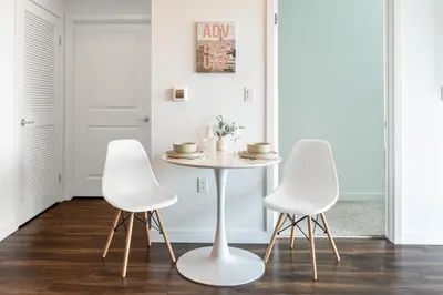 a white table and two white chairs in a room at Beautiful 1BR Apt in Hollywood w Pool and Parking in Los Angeles