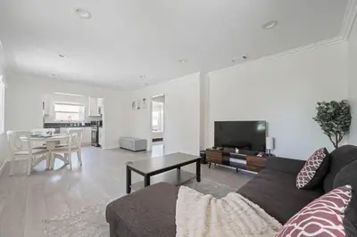 a living room with a couch and a table at Serene Home in Central Burbank in Burbank