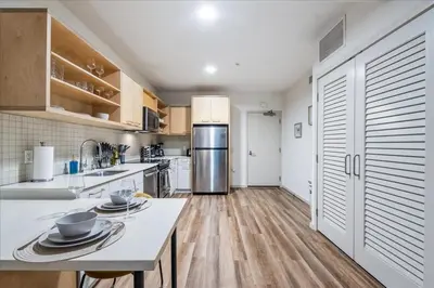 a kitchen with white counters and a refrigerator at Cozy 1BR apt in Hollywood w Pool, Gym and Parking in Los Angeles