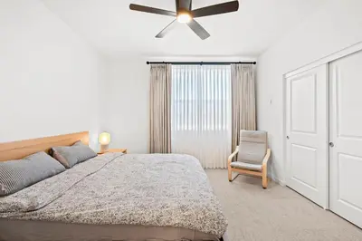 a bedroom with a bed and a ceiling fan at Luxurious Ontario Townhouse Ideal Family in Ontario