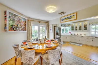 a kitchen and dining room with a table and chairs at Vibrant Home with Patio - Near Santa Monica Pier! in Los Angeles