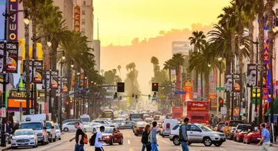 a busy city street with cars and people crossing the street at Hollywood Townhome, Resort Amenities, 2 Free Parking Spaces! in Los Angeles