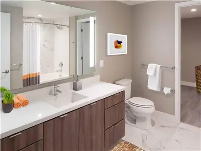 a bathroom with a sink and a toilet and a mirror at Hollywood Townhome, Resort Amenities, 2 Free Parking Spaces! in Los Angeles