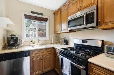 a kitchen with a stove and a microwave at 1 bd guest house in LA perfect for long term stay in Los Angeles