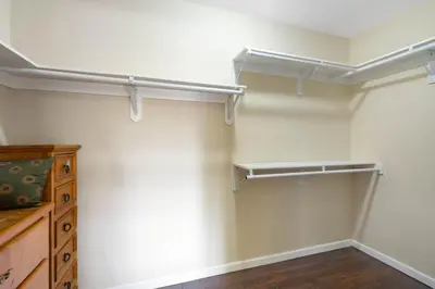 a bedroom with white walls and a closet with shelves at 1 bd guest house in LA perfect for long term stay in Los Angeles