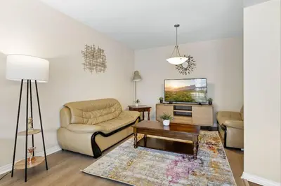 a living room with a couch and a table at Charming 2BR2BA Home Near Downtown LA And Walkable Amenities in Monterey Park