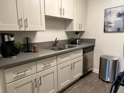 a kitchen with white cabinets and a sink at Exceptional 2 BR in Heart of Hollywood 201 in Los Angeles