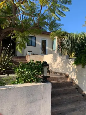 a white house with stairs in front of it at UCLA Thurston in Los Angeles