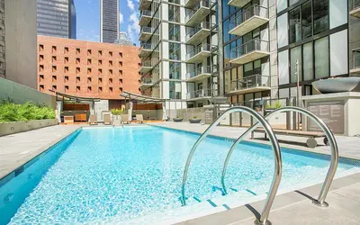 a large swimming pool in the middle of a building at 2 Bed 2 Bath Contemporary High Rise DTLA Living in Los Angeles