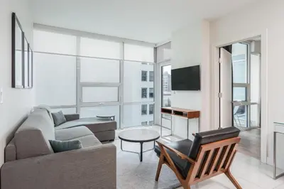 a living room with a couch and a table at 2 Bed 2 Bath Contemporary High Rise DTLA Living in Los Angeles