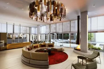 a living room with a couch and a chandelier at 2 Bed 2 Bath Contemporary High Rise DTLA Living in Los Angeles