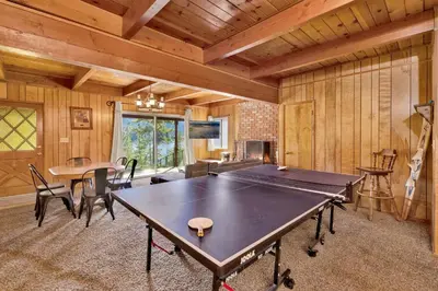 a living room with a ping pong table in it at Inspiration point retreat #2470 in Big Bear Lake