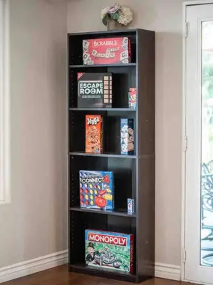 a black book shelf in a room with snacks at Secluded Romantic Getaway Home in Anaheim