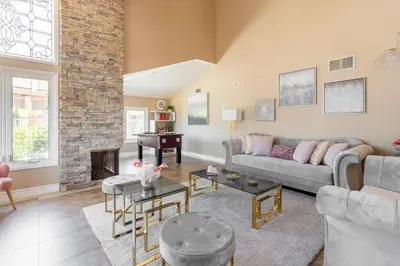 a living room with a couch and a fireplace at Majestic Anaheim Panorama Hill Home With Sunset in Anaheim