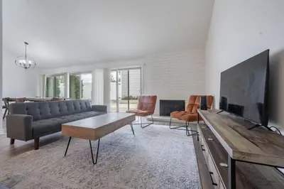 a living room with a couch and a tv at Elm Mountain View Fire pit, quiet and more in Los Angeles