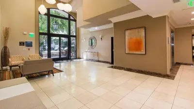 a living room with a couch and a chair at Holiday in LA - 1br with Free parking, Laundry, Pool in Los Angeles