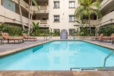 a large swimming pool in front of a building at Holiday in LA - 1br with Free parking, Laundry, Pool in Los Angeles