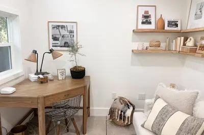 a living room with a desk and a couch at Zen Birds Nest of Topanga Boho Chic with Epic Deck in Topanga