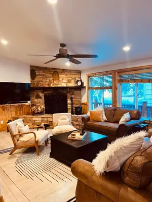 a large living room with couches and a fireplace at Château Bouli - 4 Season Escape and Games Room in Big Bear Lake