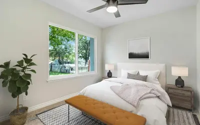 a bedroom with a bed and a window at Lancaster Pool Home in Lancaster