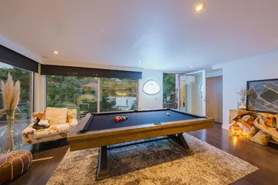 a living room with a pool table in it at Casa Azul in Los Angeles