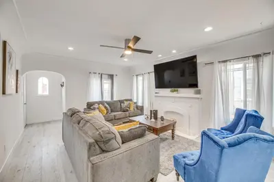 a living room with two couches and a fireplace at 2 Mi to Citadel Outlets! East LA Retreat Near I-5 in Los Angeles