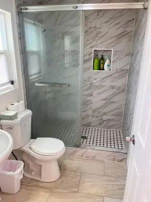a bathroom with a shower with a toilet and a sink at Studio Living,Quiet Neighborhood, Near Airport in Walnut