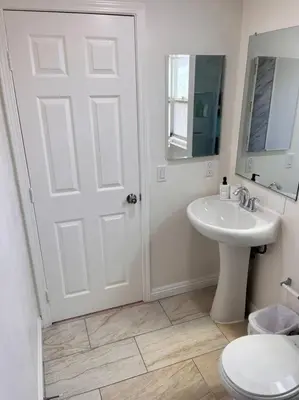 a white bathroom with a sink and a toilet at Studio Living,Quiet Neighborhood, Near Airport in Walnut