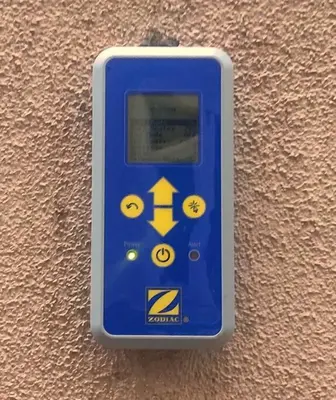 a blue remote control attached to a wall at Skyhill Pool - Walk to Universal - Resort-Style Home in Los Angeles