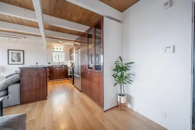 a living room with a couch and a table at Hollywood Hills Retreat with Panoramic View in Los Angeles