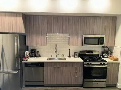 a kitchen with a sink and a stove at Stylish and Elegant apartment in Glendale