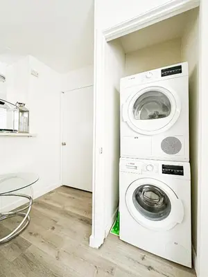 a laundry room with a washer and dryer at Charming 2-BR, 2-Story Retreat in Heart of LA - BR4 in Los Angeles