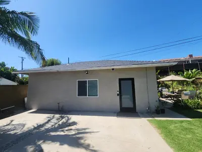 a house with a palm tree in front of it at Ladera Retreat near Sofi Stadium, LAX, Beach in Los Angeles