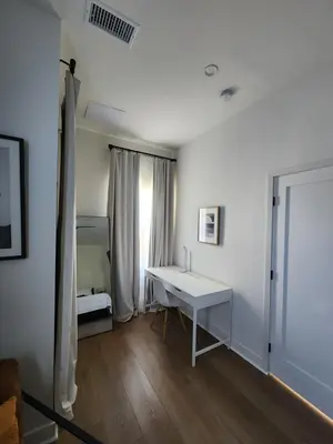 a white desk in a room with a window at Ladera Retreat near Sofi Stadium, LAX, Beach in Los Angeles