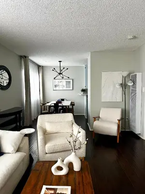 a living room with a couch and a table at The Nest Manhattan Beach, Partial Ocean View in Los Angeles