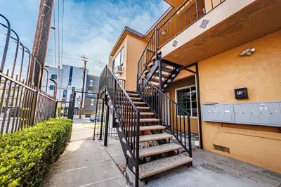 a staircase leading to a building next to a building at Gorgeous 1 Bedroom Apartment#7 in Los Angeles