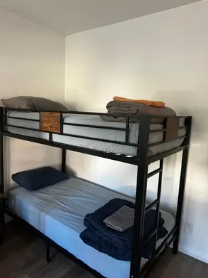 a group of bunk beds in a room at Green House in Los Angeles