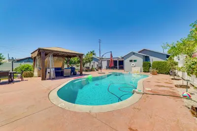 a swimming pool in the middle of a yard at Game Room, Pool! Family Home 25 Mi to Disneyland in West Covina