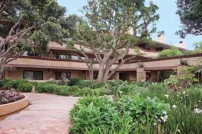 a building with a garden in front of it at Beautiful Resort in Harbortown Point ST near Marina Park in Ventura