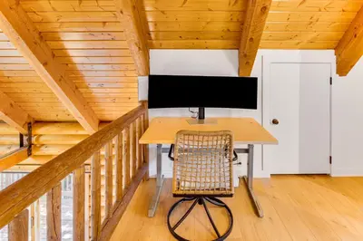 a computer desk in a room with a wooden ceiling at Community Pool Modern Cabin in Pine Mountain Club in Pine Mountain Club