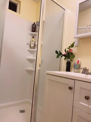 a bathroom with a shower and a sink and a mirror at private & Quiet unit D Bed & bath in Rosemead