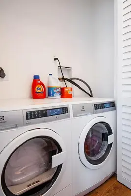 a white washer and dryer in a room at Studio, 5 minutes to Venice Beach Free Parking! in Los Angeles