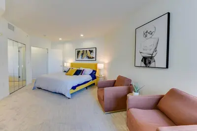 a bedroom with a bed and a couch at Lavish Living Lux Marina Views in Los Angeles