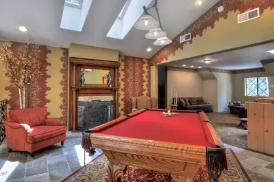 a living room with a pool table in it at No. 8 Estate By The Lake in Big Bear Lake