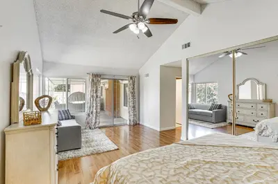 a bedroom with a bed and a ceiling fan at Huntington Beach Home Fire Pit, Grill and More! in Huntington Beach