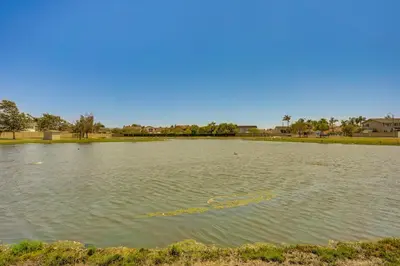 a large pond with a yellow rope in the water at Huntington Beach Home Fire Pit, Grill and More! in Huntington Beach