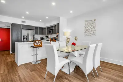 a kitchen and dining room with a table and chairs at Amazing, Spacious Unit, Heart LA in Los Angeles
